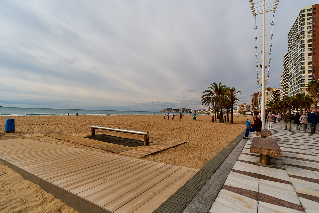 Levante beach and promenade in Benidorm during the day